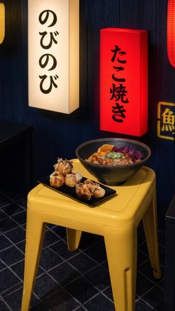 Nouilles ramen et takoyaki servis sur une table jaune dans un restaurant asiatique Nobi Nobi Mérignac