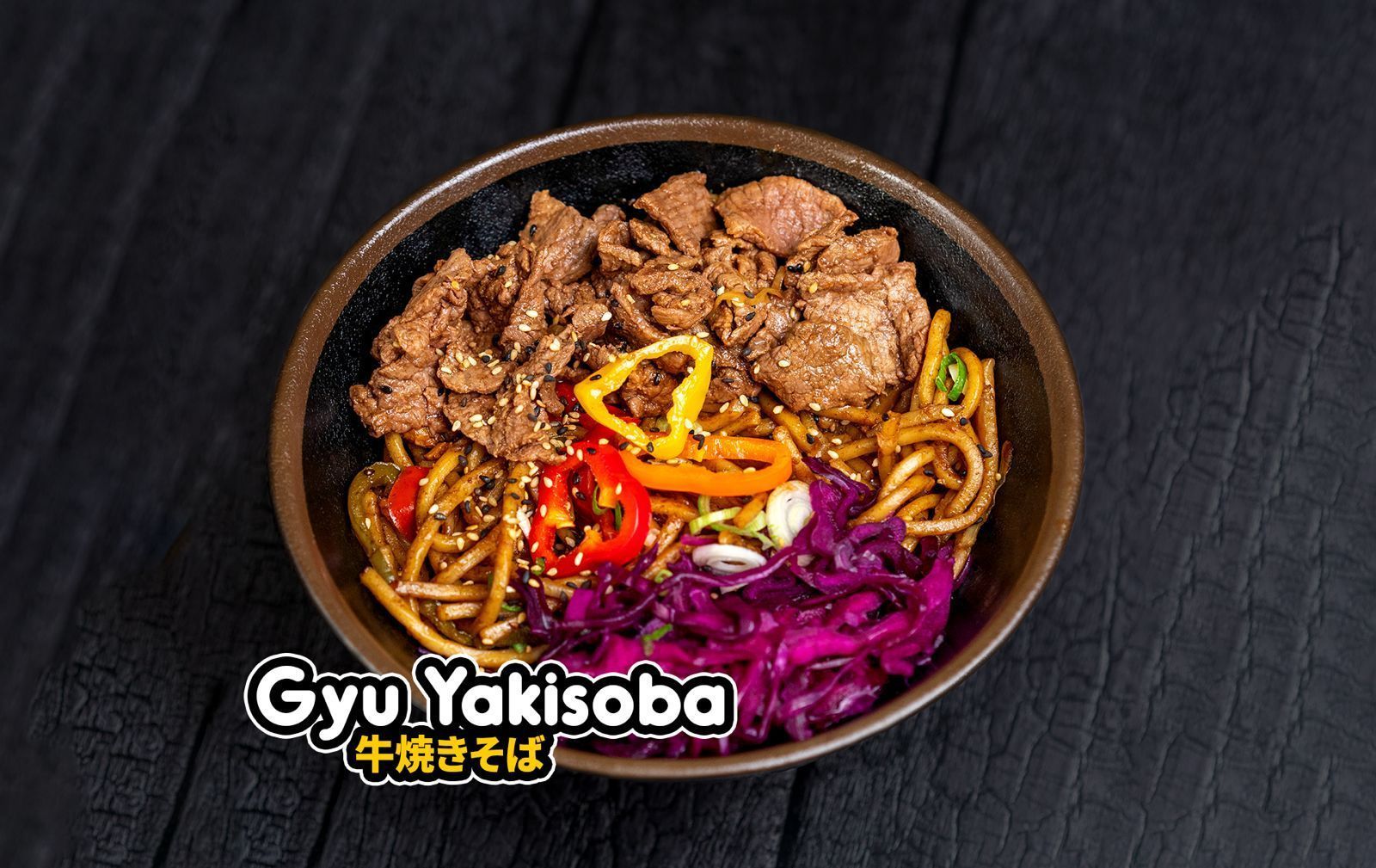 Bowl of Gyu Yakisoba with beef, noodles, red peppers, and purple cabbage from Nobi Nobi Bayonne restaurant.